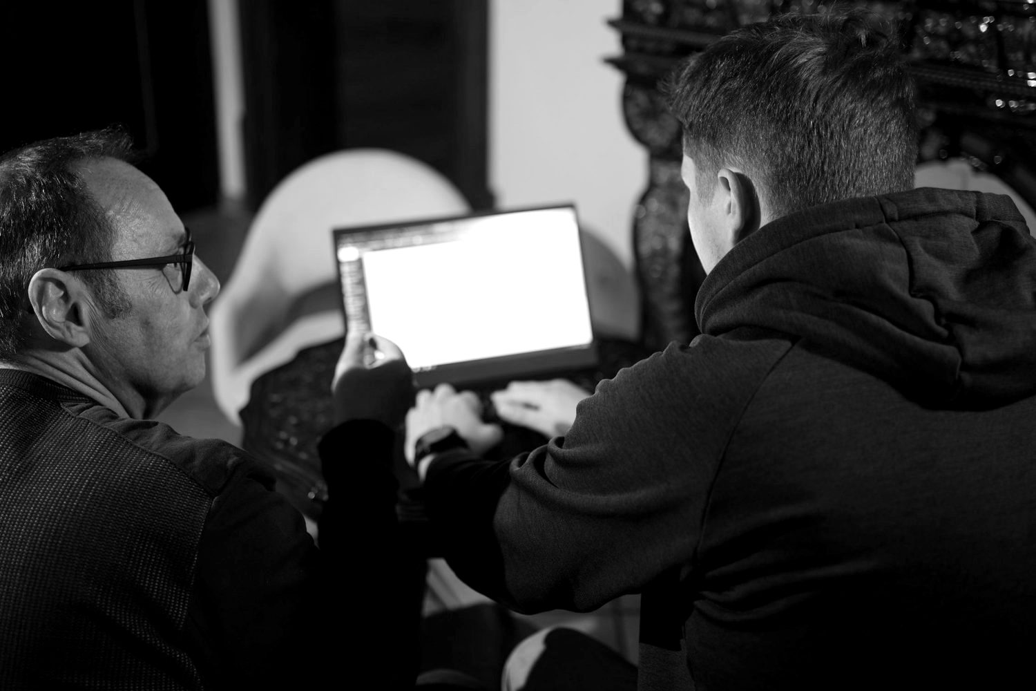 Wolfgang Schuster and Alexander Hock working together on a laptop
